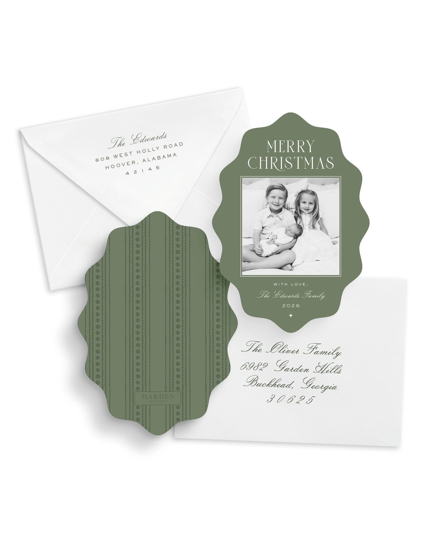 Christmas card with photo of three children and decorative green design on a white background