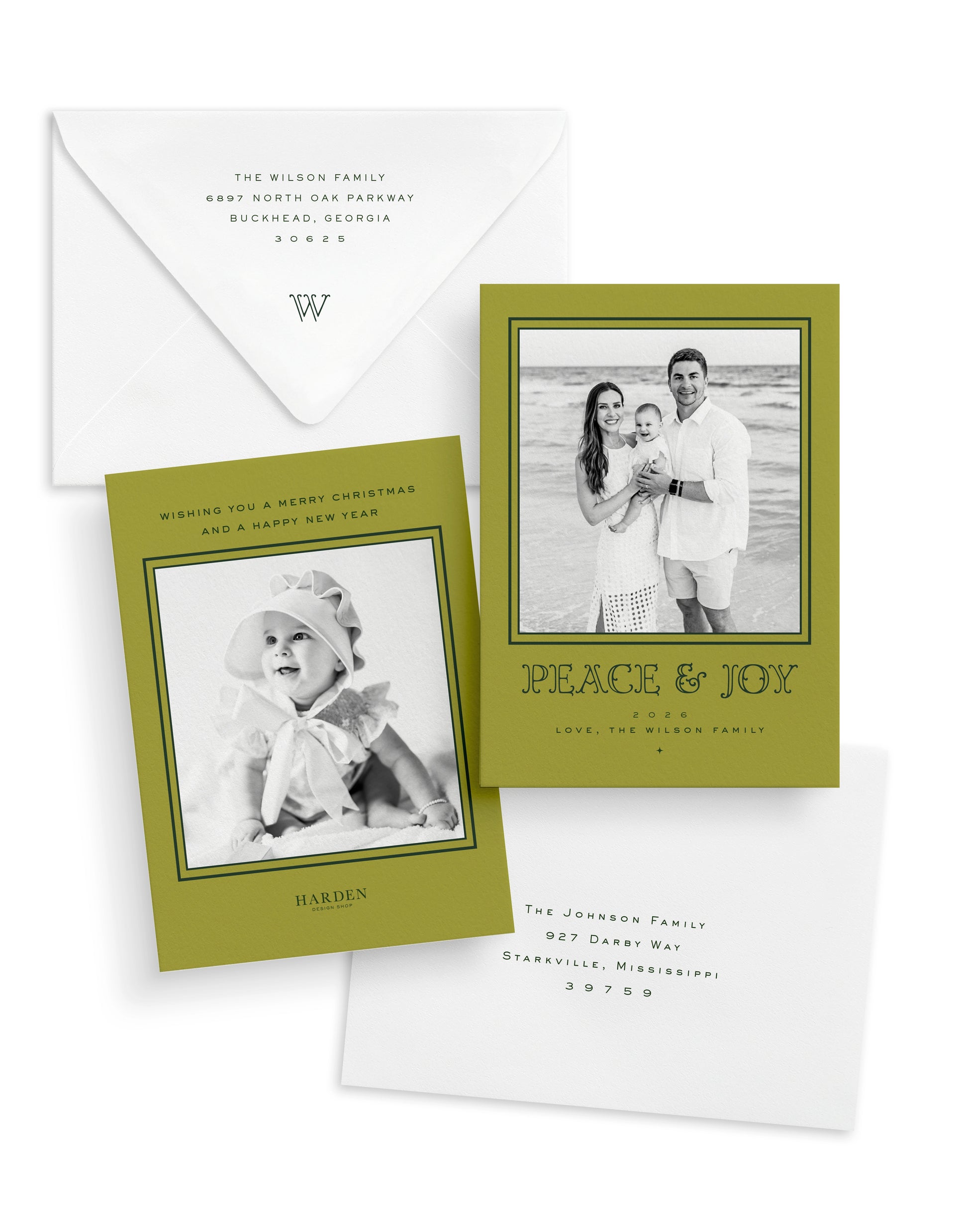 Christmas cards with black and white photos and a chartreuse border and envelopes on a white background