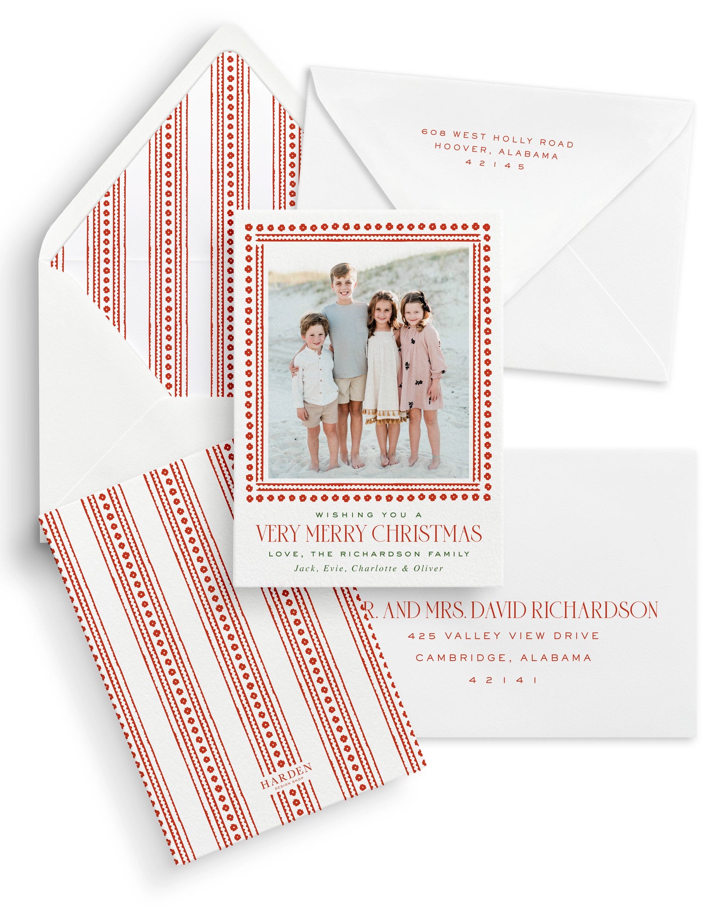 Christmas card with photo of four children on a beach and decorative border, featuring an envelope and return address label.